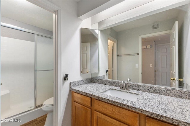 839 S Westwood Unit 154, Mesa, AZ 85210 - bathroom featuring a shower stall, vanity, toilet, and wood finished floors