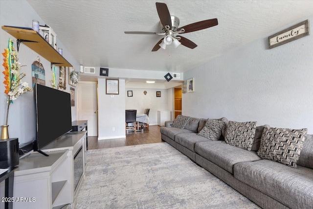 839 S Westwood Unit 154, Mesa, AZ 85210 - living room featuring wood finished floors, ceiling fan, and a textured ceiling