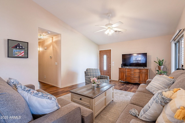 living room featuring vaulted ceiling, ceiling fan, and wood-type flooring