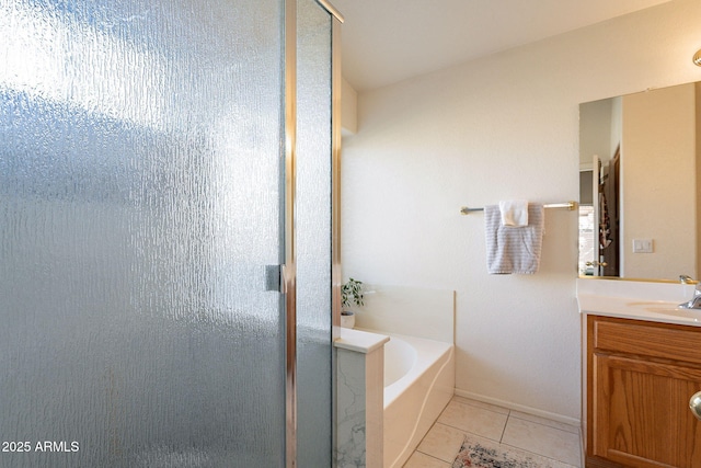 bathroom with plus walk in shower, tile patterned flooring, and vanity