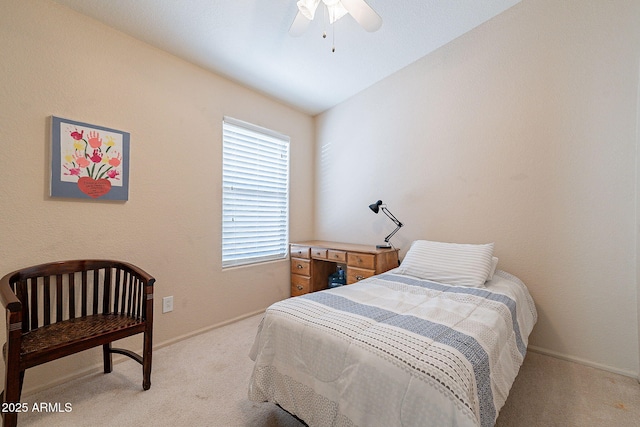 carpeted bedroom featuring ceiling fan and vaulted ceiling