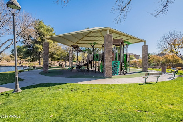 view of property's community featuring a yard and a playground