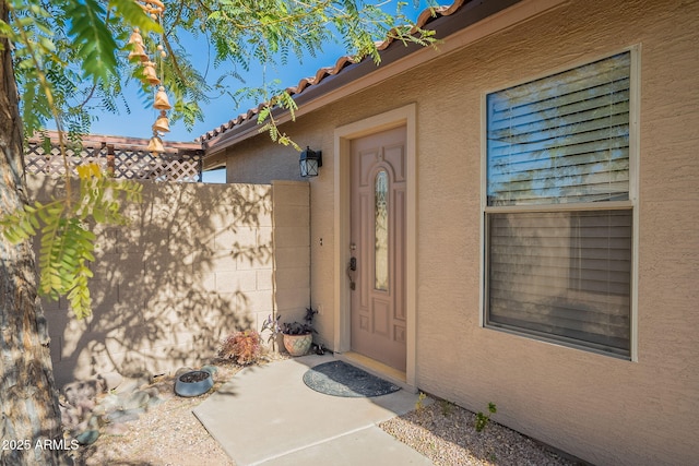 doorway to property with a patio area