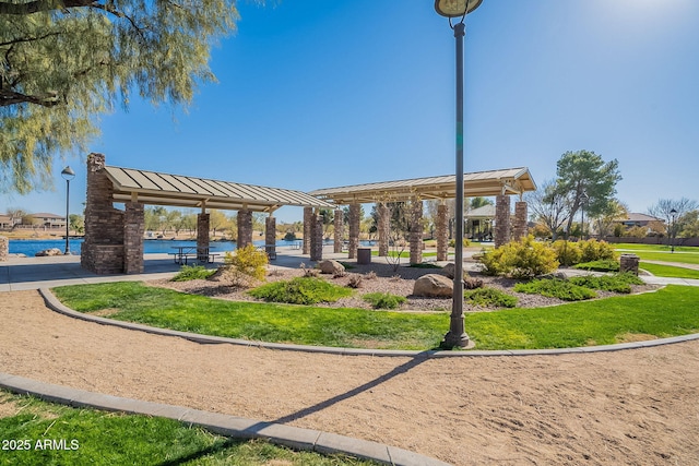 view of community with a water view and a gazebo