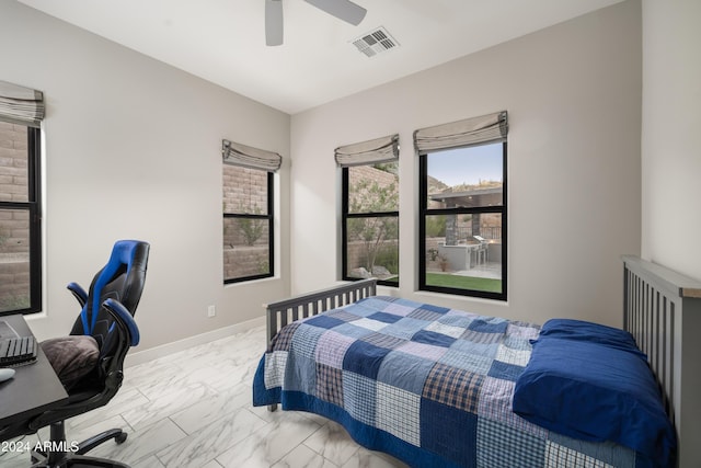 bedroom featuring ceiling fan, marble finish floor, visible vents, and baseboards