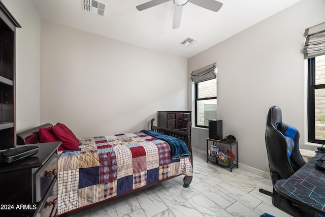 bedroom featuring ceiling fan, marble finish floor, visible vents, and baseboards