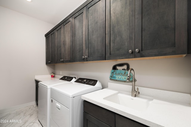 laundry area with separate washer and dryer, a sink, baseboards, marble finish floor, and cabinet space