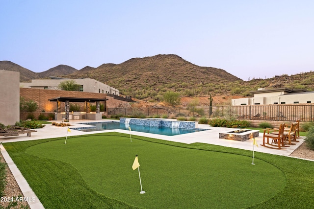 view of pool featuring a fenced in pool, a fenced backyard, a patio, and a fire pit