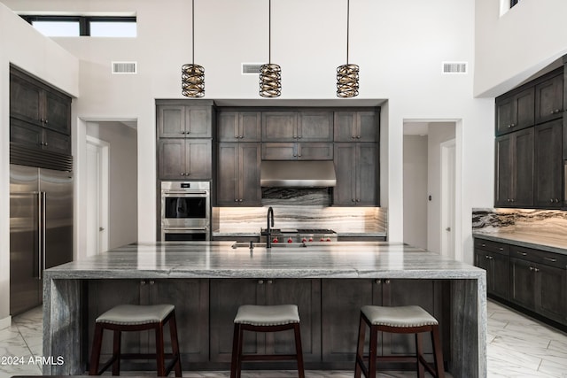 kitchen featuring marble finish floor, visible vents, and stainless steel appliances