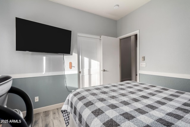 bedroom with light wood-type flooring