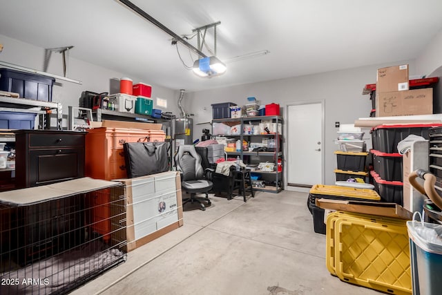 garage with water heater and a garage door opener