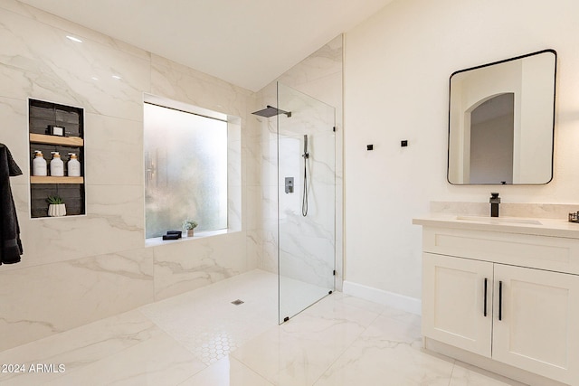 bathroom with vanity, lofted ceiling, and tiled shower