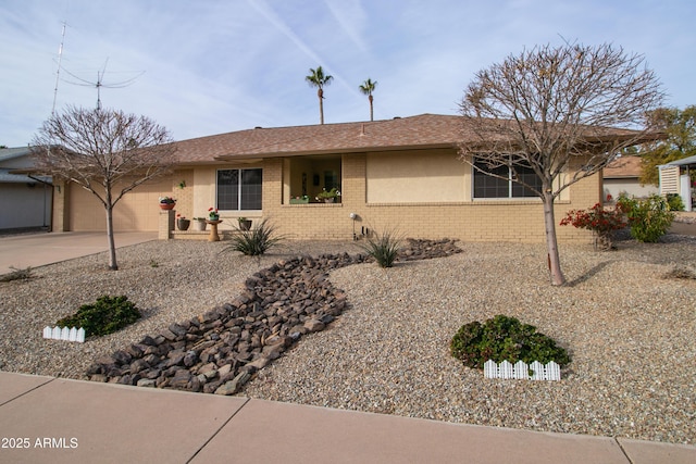 ranch-style home featuring a garage