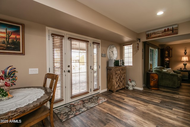 entrance foyer featuring french doors and dark hardwood / wood-style floors