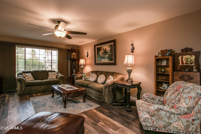 living room featuring dark hardwood / wood-style floors and ceiling fan