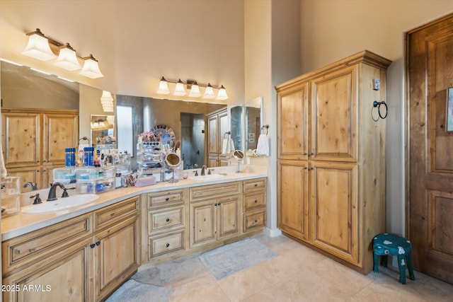 7846 E Wilderness Trl, Gold Canyon, AZ 85118 - full bathroom featuring double vanity, tile patterned flooring, and a towering ceiling