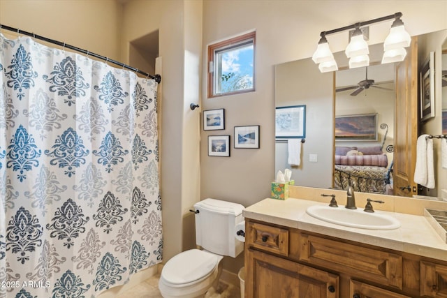 7846 E Wilderness Trl, Gold Canyon, AZ 85118 - full bathroom featuring toilet, vanity, a ceiling fan, and curtained shower
