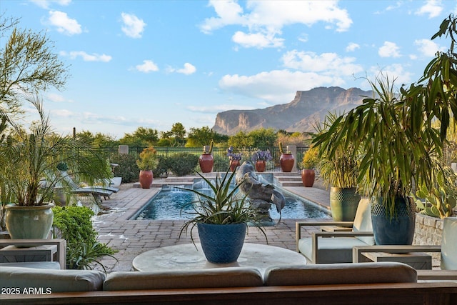 7846 E Wilderness Trl, Gold Canyon, AZ 85118 - view of swimming pool with a mountain view, a patio area, and a fenced backyard