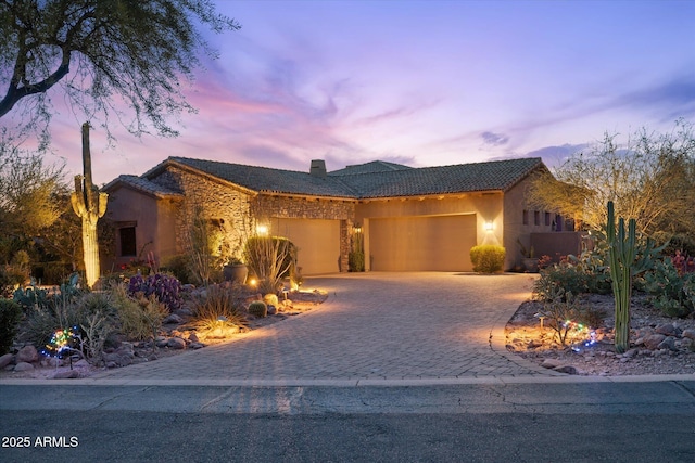 7846 E Wilderness Trl, Gold Canyon, AZ 85118 - single story home with an attached garage, decorative driveway, a tiled roof, and stucco siding