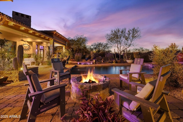 7846 E Wilderness Trl, Gold Canyon, AZ 85118 - view of patio / terrace with a fire pit, an outdoor pool, and ceiling fan