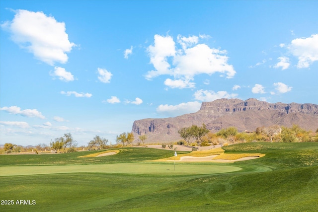 7846 E Wilderness Trl, Gold Canyon, AZ 85118 - surrounding community featuring a putting green, a mountain view, a lawn, and view of golf course