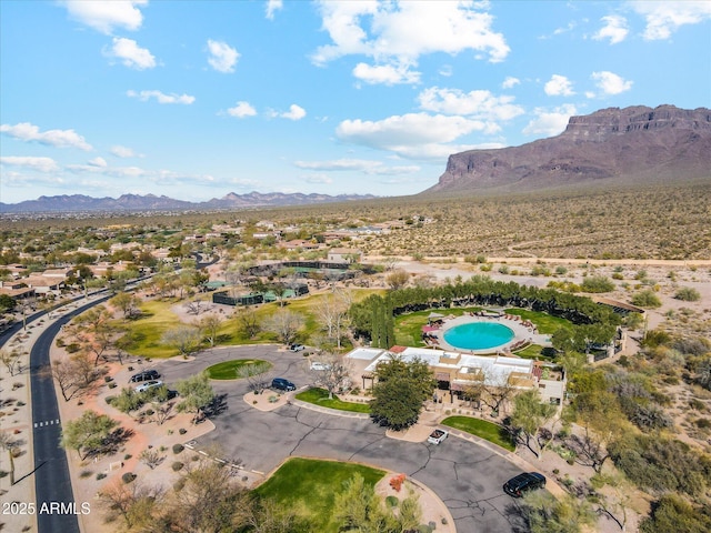 7846 E Wilderness Trl, Gold Canyon, AZ 85118 - aerial view of property and surrounding area with a mountain backdrop and a pool area