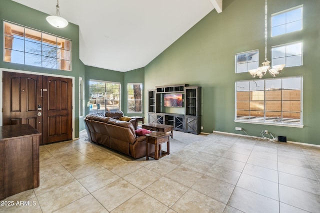 living area featuring tile patterned flooring, baseboards, and high vaulted ceiling