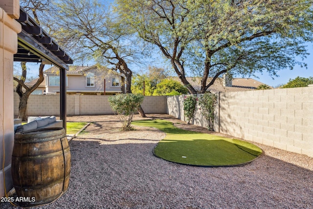 view of yard with a fenced backyard