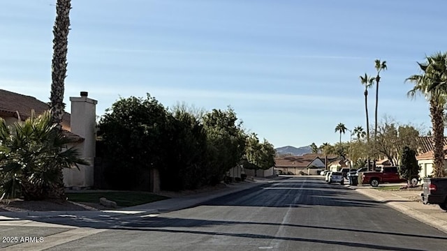 view of road with curbs and sidewalks