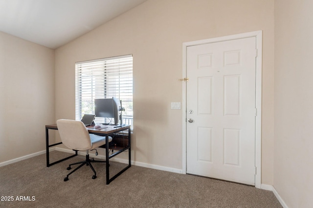 home office featuring vaulted ceiling, carpet flooring, and baseboards