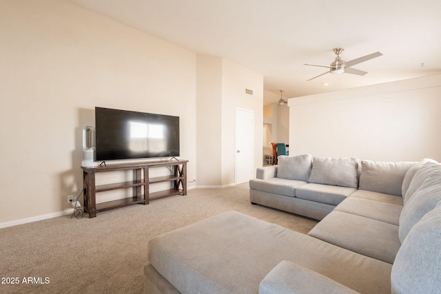 carpeted living room with ceiling fan and baseboards