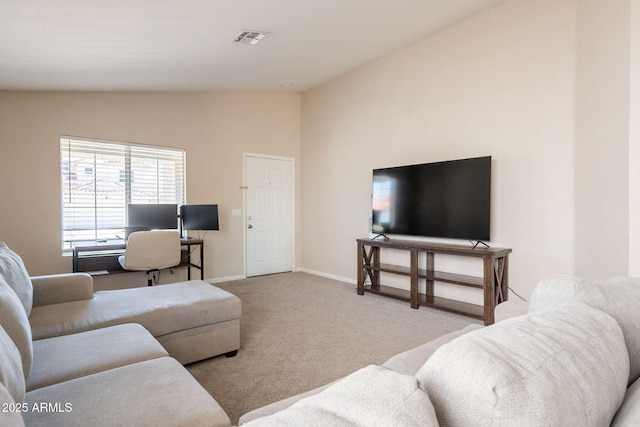 living room with vaulted ceiling, carpet, and baseboards