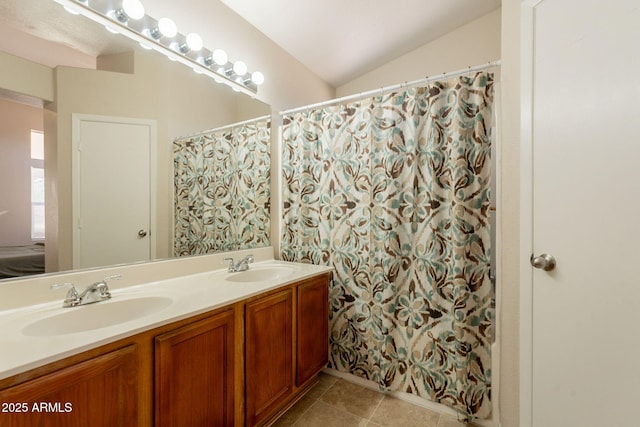 full bath featuring double vanity, tile patterned flooring, and ensuite bath