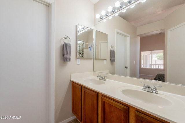 bathroom featuring connected bathroom and double vanity