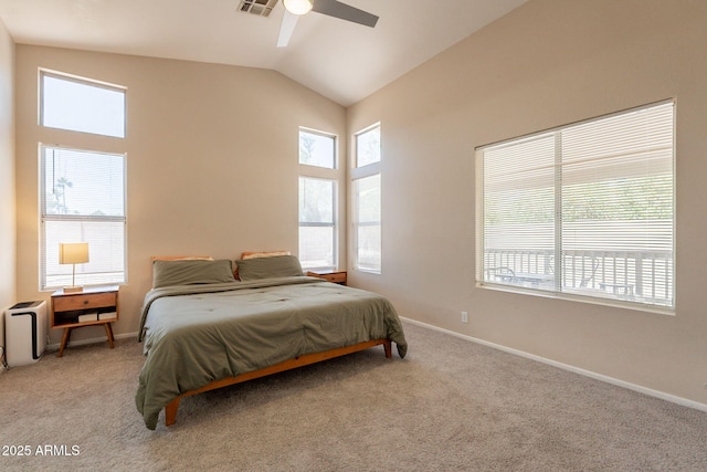 carpeted bedroom with lofted ceiling, baseboards, and ceiling fan