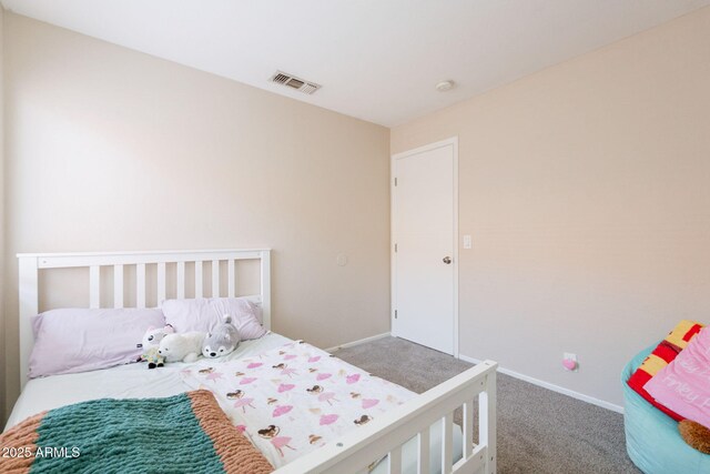 carpeted bedroom featuring baseboards