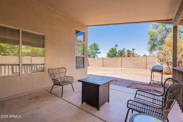 view of patio featuring a grill and a fenced backyard