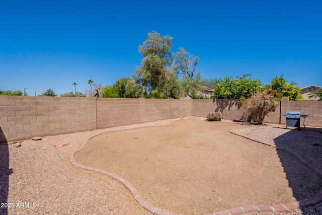 fenced backyard featuring a patio