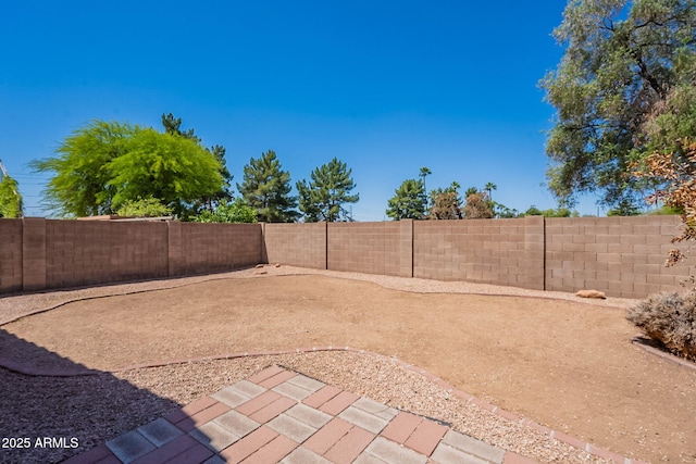 fenced backyard featuring a patio area