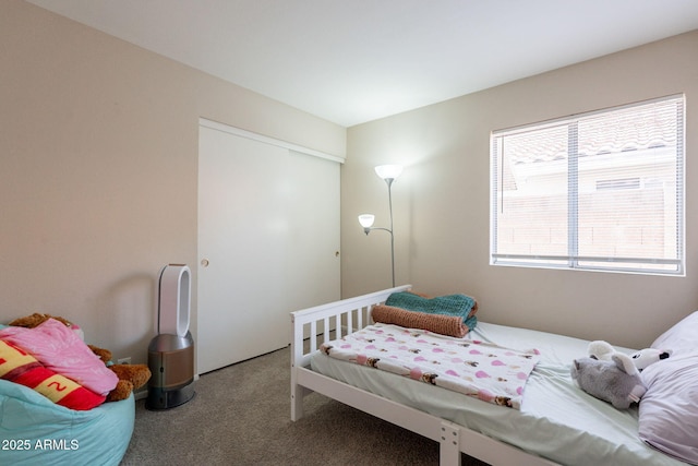 carpeted bedroom with a closet