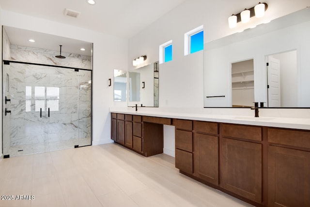 16994 W Canterbury Dr, Surprise, AZ 85388 - bathroom with a marble finish shower, double vanity, and recessed lighting