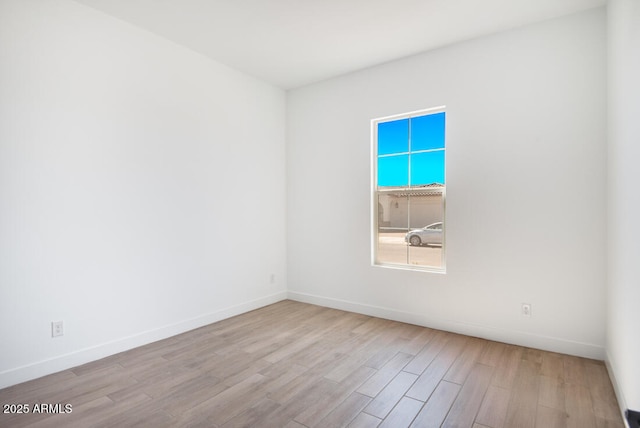 16994 W Canterbury Dr, Surprise, AZ 85388 - spare room featuring wood finished floors and baseboards