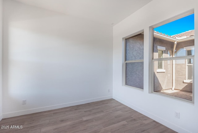 16994 W Canterbury Dr, Surprise, AZ 85388 - empty room featuring wood finished floors and baseboards
