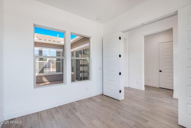 16994 W Canterbury Dr, Surprise, AZ 85388 - empty room with light wood-style flooring and baseboards