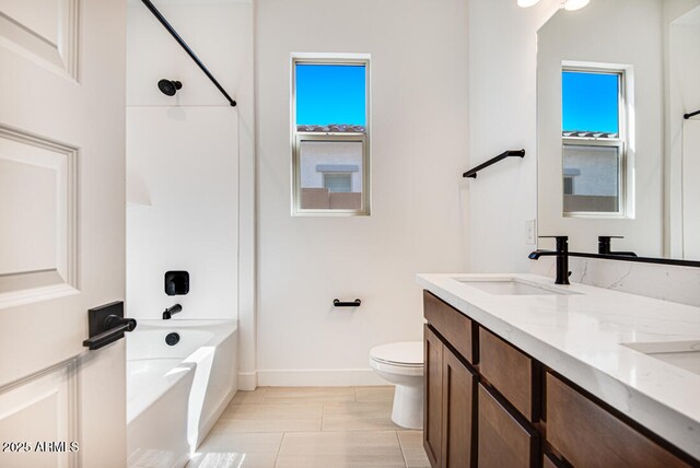 16994 W Canterbury Dr, Surprise, AZ 85388 - full bath with baseboards, toilet, double vanity, and shower / tub combination