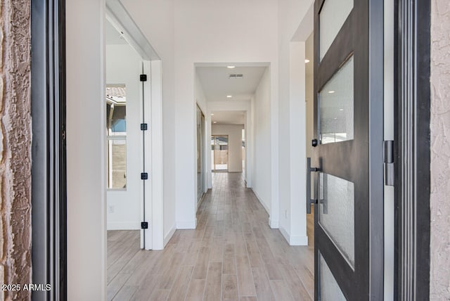 16994 W Canterbury Dr, Surprise, AZ 85388 - hallway with baseboards and light wood-style flooring