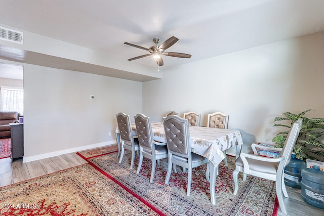 dining area featuring ceiling fan and wood-type flooring