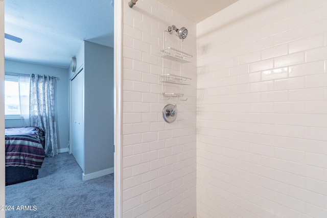 bathroom featuring tiled shower