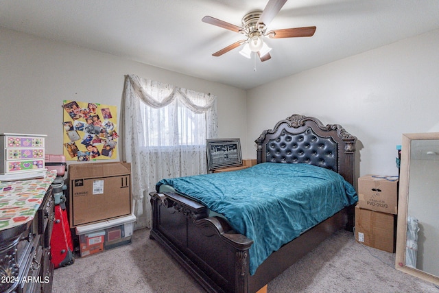 bedroom featuring ceiling fan and light carpet