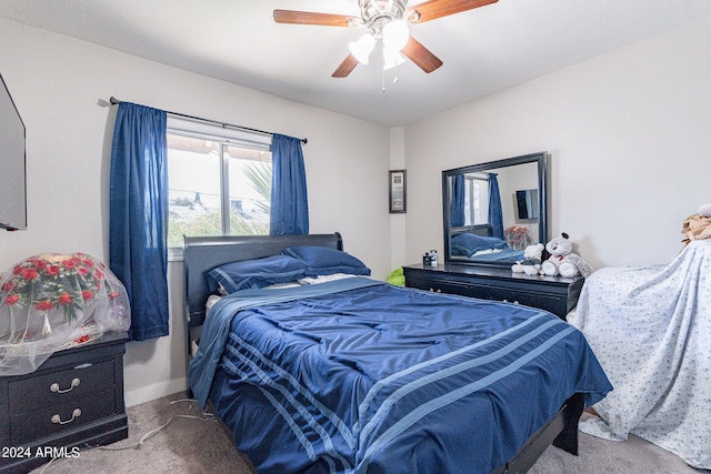 bedroom featuring ceiling fan and carpet flooring